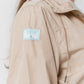 abrigo-cortavientos-poliester-reciclado-beige-Greener-06